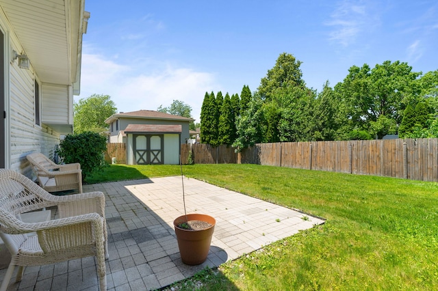 2180 Newport Cir, Hanover Park, IL 60133 - fenced backyard with a storage unit and a patio area