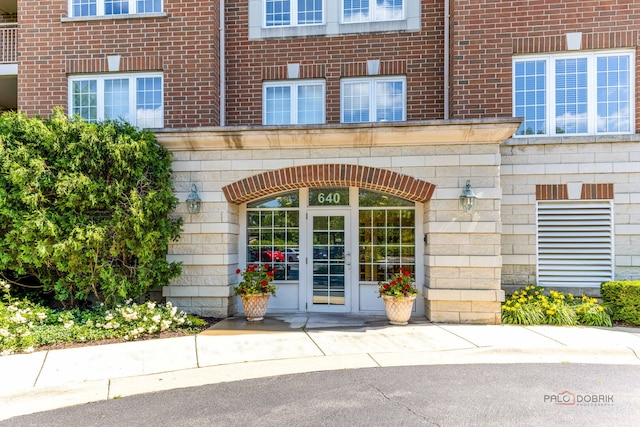 640 Robert York Ave Unit 306, Deerfield, IL 60015 - view of exterior entry featuring brick siding