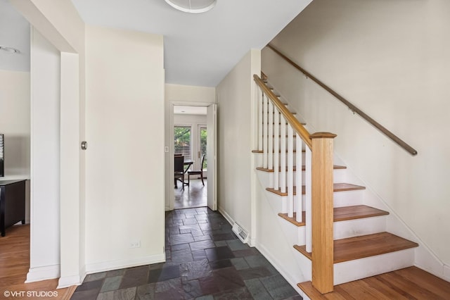 2340 Pomona Ln, Wilmette, IL 60091 - stairs featuring baseboards and stone tile floors