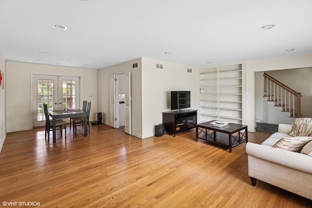 2340 Pomona Ln, Wilmette, IL 60091 - living room featuring light wood-style floors, built in features, stairway, french doors, and recessed lighting