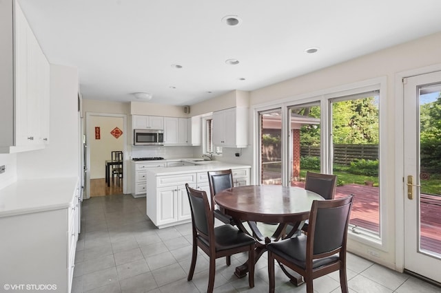 2340 Pomona Ln, Wilmette, IL 60091 - dining space with light tile patterned floors and recessed lighting