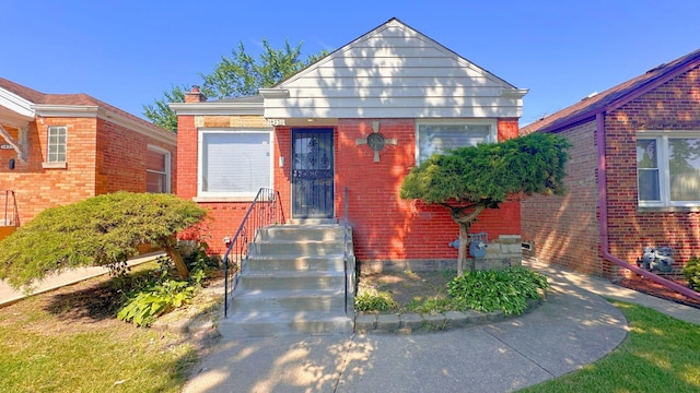 14230 S Union Ave, Riverdale, IL 60827 - bungalow-style house with brick siding and a chimney