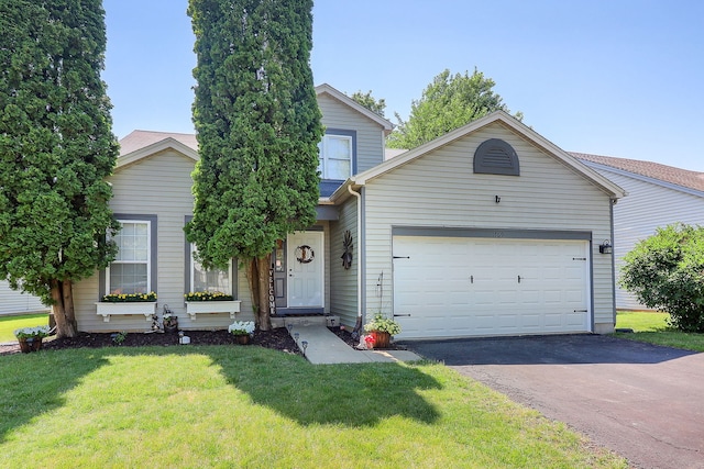 1769 Autumn Woods Ln, Romeoville, IL 60446 - view of front of property with asphalt driveway, an attached garage, and a front lawn