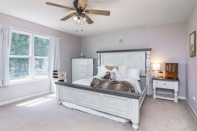 1769 Autumn Woods Ln, Romeoville, IL 60446 - bedroom featuring light carpet, multiple windows, and a ceiling fan