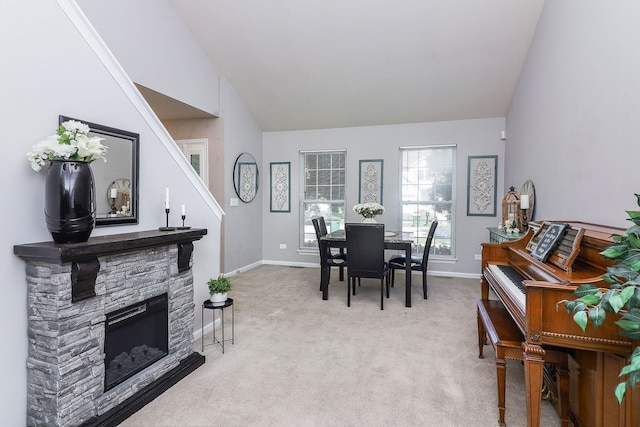 1769 Autumn Woods Ln, Romeoville, IL 60446 - dining area with vaulted ceiling, light colored carpet, and a fireplace