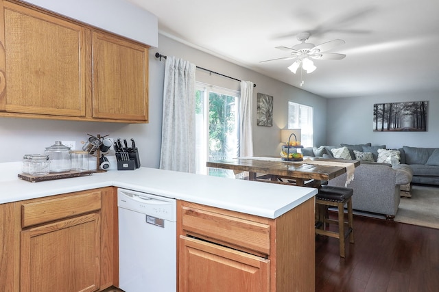 1769 Autumn Woods Ln, Romeoville, IL 60446 - kitchen with dishwasher, a peninsula, ceiling fan, dark wood finished floors, and light countertops