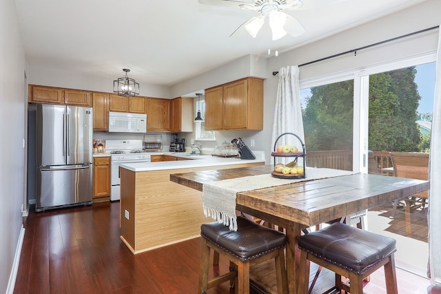 1769 Autumn Woods Ln, Romeoville, IL 60446 - kitchen featuring white appliances, light countertops, ceiling fan, dark wood finished floors, and brown cabinetry
