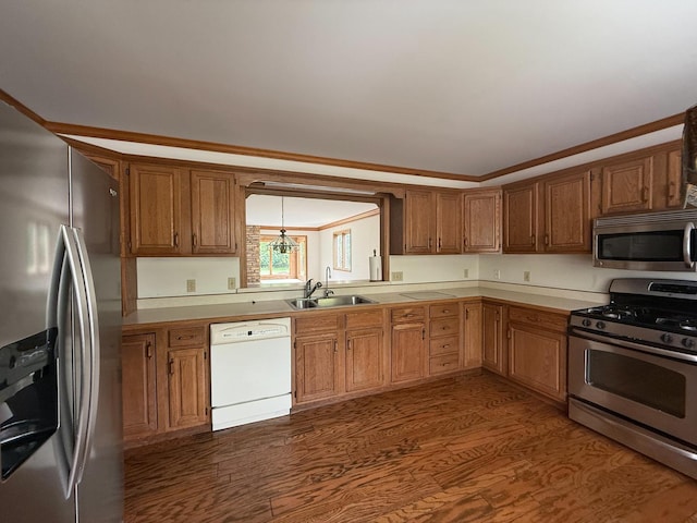 3030 Fairway Oaks Ln Unit 3030, Dekalb, IL 60115 - kitchen with appliances with stainless steel finishes, light countertops, dark wood-type flooring, brown cabinetry, and a chandelier