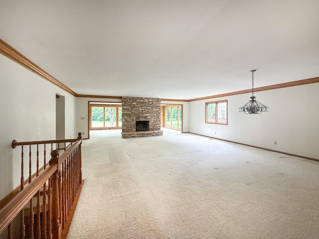 3030 Fairway Oaks Ln Unit 3030, Dekalb, IL 60115 - unfurnished living room featuring crown molding, light colored carpet, healthy amount of natural light, and a stone fireplace