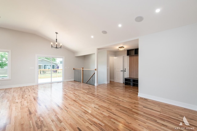 9124 S 88th Ave, Hickory Hills, IL 60457 - unfurnished living room with light wood-style floors, vaulted ceiling, a chandelier, and recessed lighting