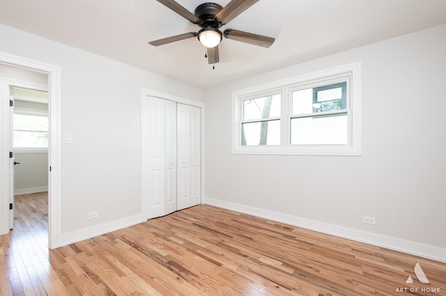 9124 S 88th Ave, Hickory Hills, IL 60457 - unfurnished bedroom with light wood-style floors, a closet, and a ceiling fan