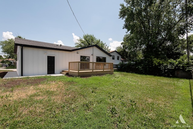 9124 S 88th Ave, Hickory Hills, IL 60457 - rear view of house with a deck, a yard, and board and batten siding
