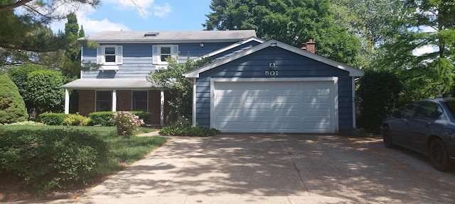 501 Hemlock Ln, Libertyville, IL 60048 - view of front facade with a chimney, a detached garage, and brick siding