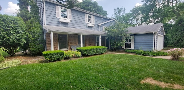 501 Hemlock Ln, Libertyville, IL 60048 - traditional-style house with a front yard and brick siding
