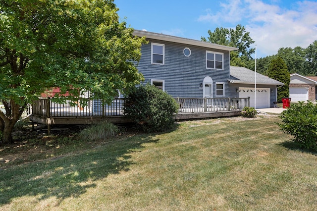 2612 Valkar Ln, Champaign, IL 61822 - back of property with an attached garage, a yard, a wooden deck, and driveway
