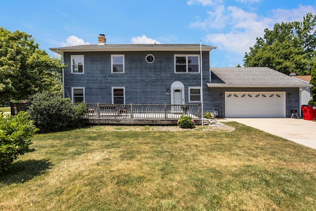 2612 Valkar Ln, Champaign, IL 61822 - colonial home featuring a chimney, an attached garage, concrete driveway, and a front yard