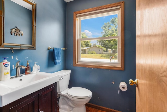2612 Valkar Ln, Champaign, IL 61822 - half bath featuring vanity and wood finished floors