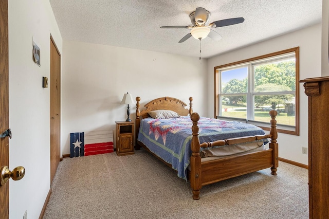 2612 Valkar Ln, Champaign, IL 61822 - bedroom with light carpet, a textured ceiling, and a ceiling fan