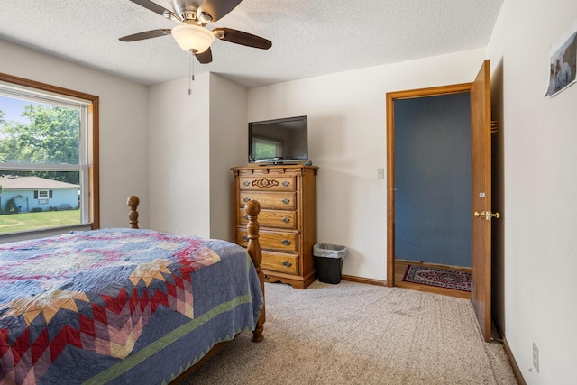 2612 Valkar Ln, Champaign, IL 61822 - bedroom featuring light carpet, a textured ceiling, and a ceiling fan