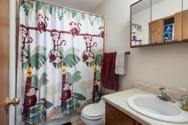 2612 Valkar Ln, Champaign, IL 61822 - bathroom featuring a textured ceiling, vanity, and a shower with shower curtain