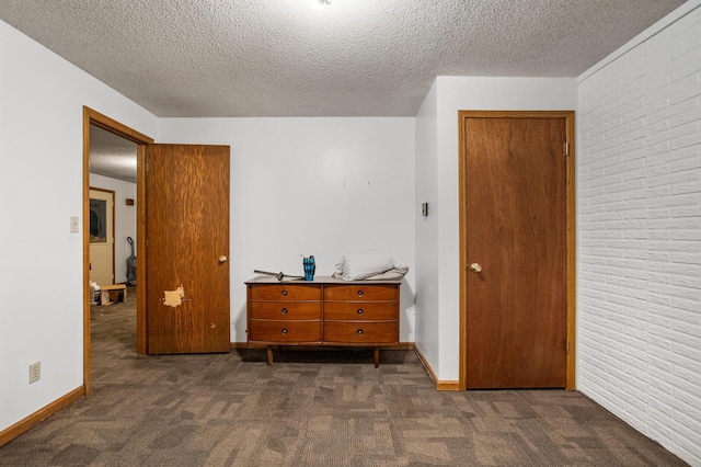 2612 Valkar Ln, Champaign, IL 61822 - bedroom with dark carpet and a textured ceiling