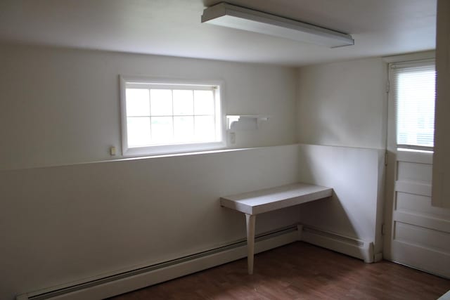 819 S W St, Earlville, IL 60518 - unfurnished room featuring baseboard heating and wood finished floors