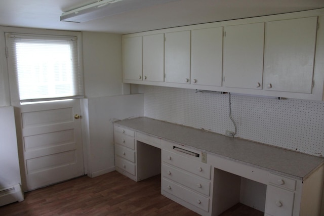 819 S W St, Earlville, IL 60518 - unfurnished office featuring a baseboard radiator, built in desk, and wood finished floors