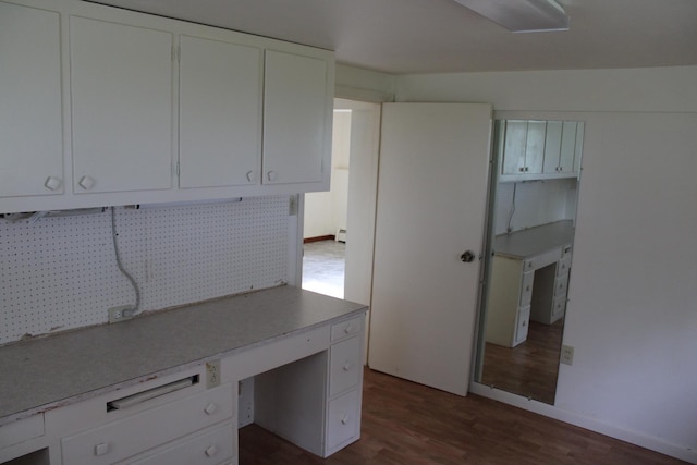 819 S W St, Earlville, IL 60518 - unfurnished office with dark wood-type flooring and baseboard heating