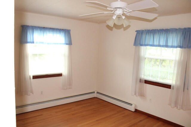 819 S W St, Earlville, IL 60518 - unfurnished room featuring healthy amount of natural light, ceiling fan, light wood-type flooring, and baseboard heating