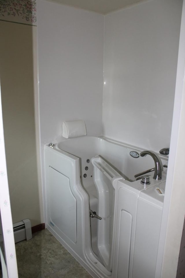 819 S W St, Earlville, IL 60518 - full bathroom with a baseboard radiator, a jetted tub, and washer / clothes dryer