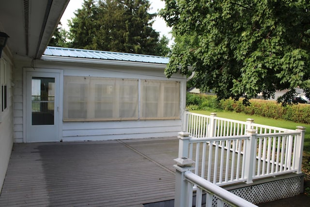 819 S W St, Earlville, IL 60518 - wooden deck with a sunroom and a lawn