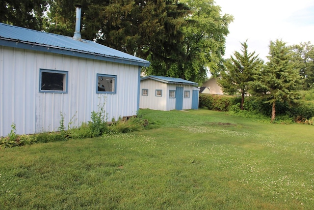 819 S W St, Earlville, IL 60518 - view of grassy yard featuring an outdoor structure