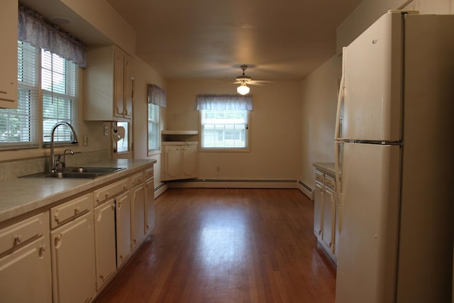 819 S W St, Earlville, IL 60518 - kitchen featuring freestanding refrigerator, white cabinetry, wood finished floors, a ceiling fan, and light countertops