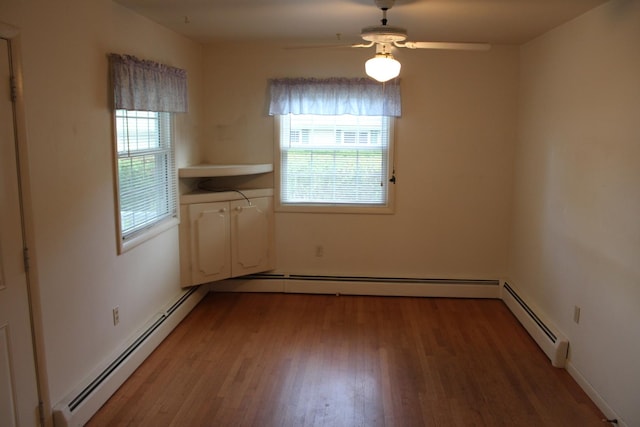 819 S W St, Earlville, IL 60518 - unfurnished dining area with a baseboard heating unit, light wood-style flooring, and ceiling fan