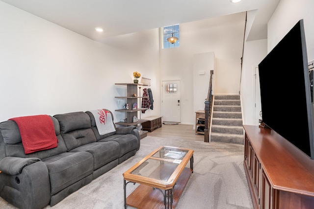 15135 W Quincy Cir, Manhattan, IL 60442 - living area with light colored carpet, stairway, and recessed lighting