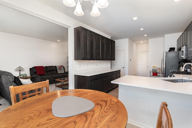 15135 W Quincy Cir, Manhattan, IL 60442 - dining space with light wood-style flooring, a chandelier, and recessed lighting