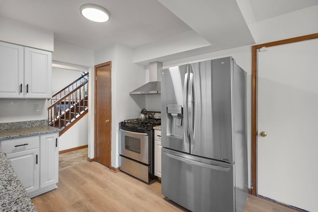 96 Townsend Cir, Naperville, IL 60565 - kitchen featuring stainless steel appliances, wall chimney exhaust hood, white cabinets, and light wood-type flooring