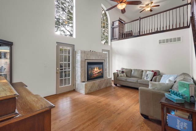 96 Townsend Cir, Naperville, IL 60565 - living room featuring a high ceiling, a ceiling fan, wood finished floors, and a premium fireplace