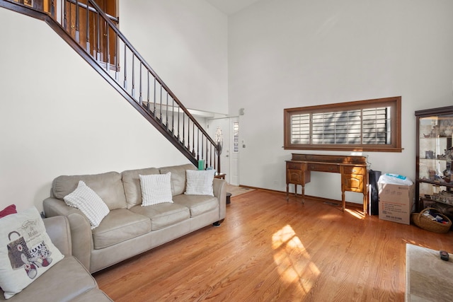 96 Townsend Cir, Naperville, IL 60565 - living area featuring stairs, wood finished floors, and a towering ceiling