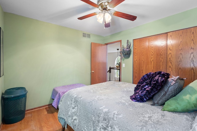 96 Townsend Cir, Naperville, IL 60565 - bedroom featuring wood finished floors, a closet, and ceiling fan
