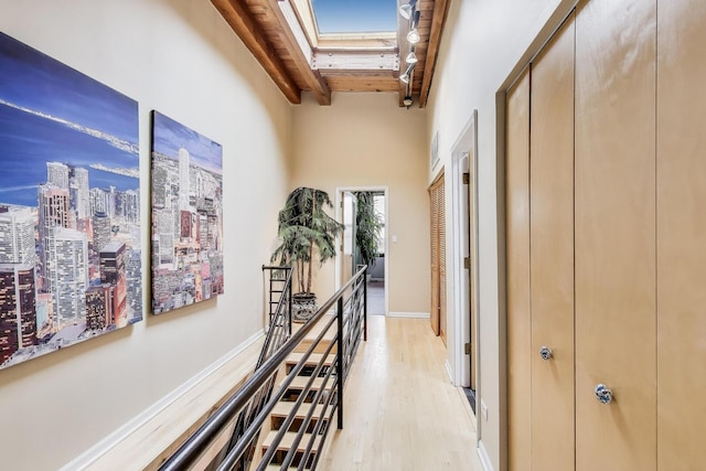 1740 N Marshfield Ave Unit 30, Chicago, IL 60622 - hallway with a skylight, beam ceiling, and light wood-style flooring