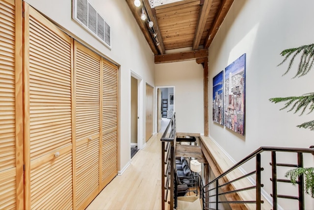 1740 N Marshfield Ave Unit 30, Chicago, IL 60622 - corridor with an upstairs landing, wood finished floors, and a wooden ceiling with exposed beams