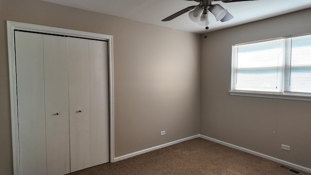 25601 Linden Ave, Monee, IL 60449 - unfurnished bedroom featuring carpet, a closet, and a ceiling fan