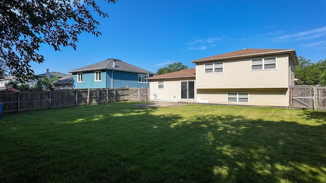 25601 Linden Ave, Monee, IL 60449 - back of house featuring a fenced backyard, a patio area, and a gate