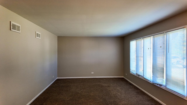 25601 Linden Ave, Monee, IL 60449 - empty room featuring dark carpet and baseboards