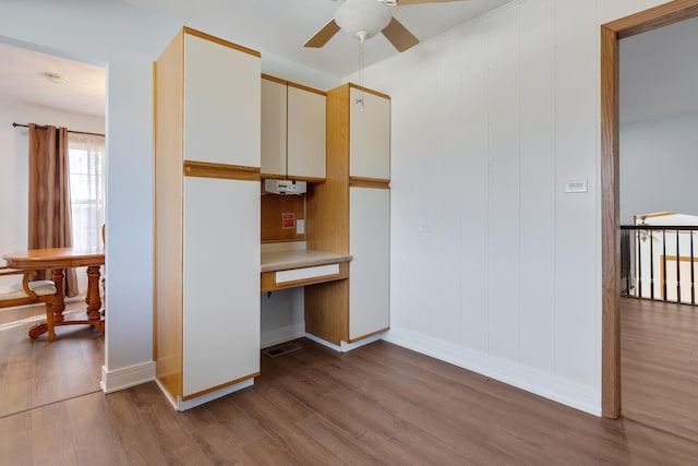 1165 Mayfield Ln, Hoffman Estates, IL 60169 - unfurnished bedroom featuring built in desk and wood finished floors