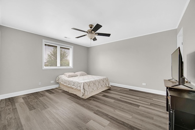 17824 Bernard Dr Unit 3D, Orland Park, IL 60467 - bedroom with wood finished floors, ceiling fan, and crown molding