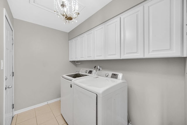 17824 Bernard Dr Unit 3D, Orland Park, IL 60467 - laundry room with independent washer and dryer, cabinet space, a chandelier, and light tile patterned floors