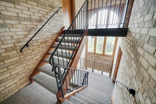 17824 Bernard Dr Unit 3D, Orland Park, IL 60467 - staircase with carpet and brick wall