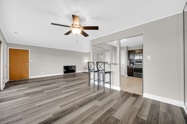 17824 Bernard Dr Unit 3D, Orland Park, IL 60467 - unfurnished living room featuring a ceiling fan and light wood finished floors